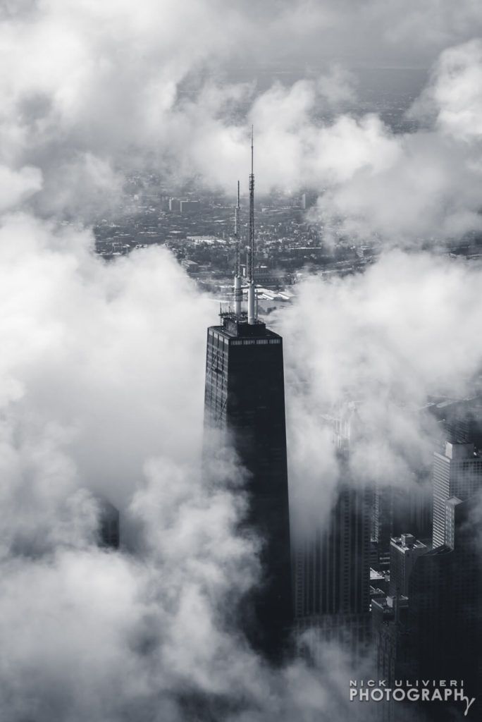 Aerial of John Hancock through the fog Designed by Skidmore Owings  Merrill