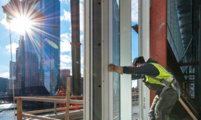 Hanging glass at Wolf Point East  for Walsh Group