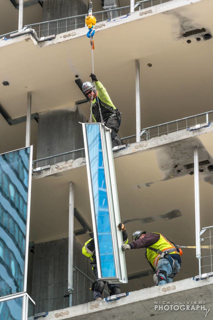 Curtain wall installation at Wolf Point East  For Walsh Group