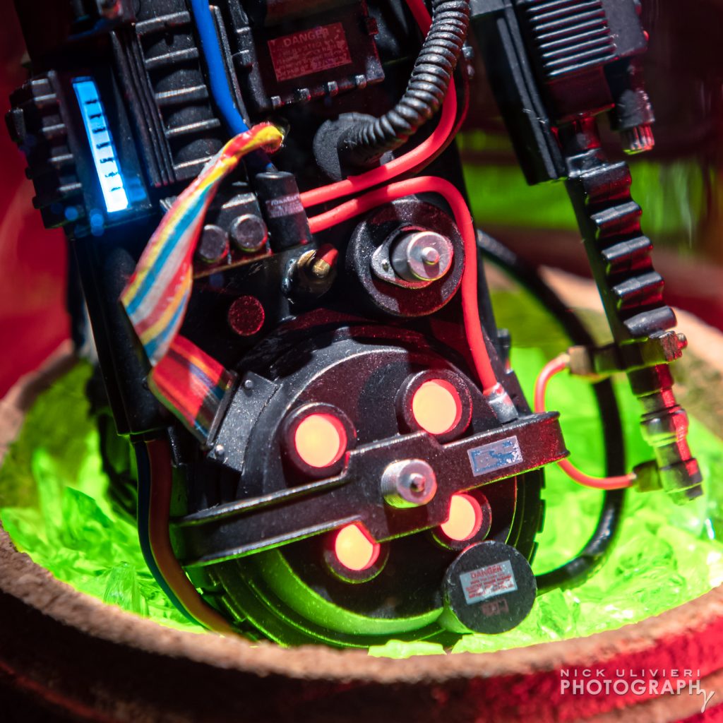 Close-detail of the proton pack nestled in the crushed glass base