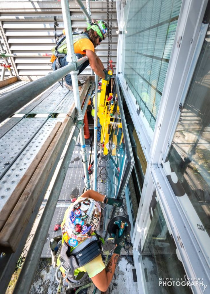 Teamwork is required to properly seat the vertical windows into place.