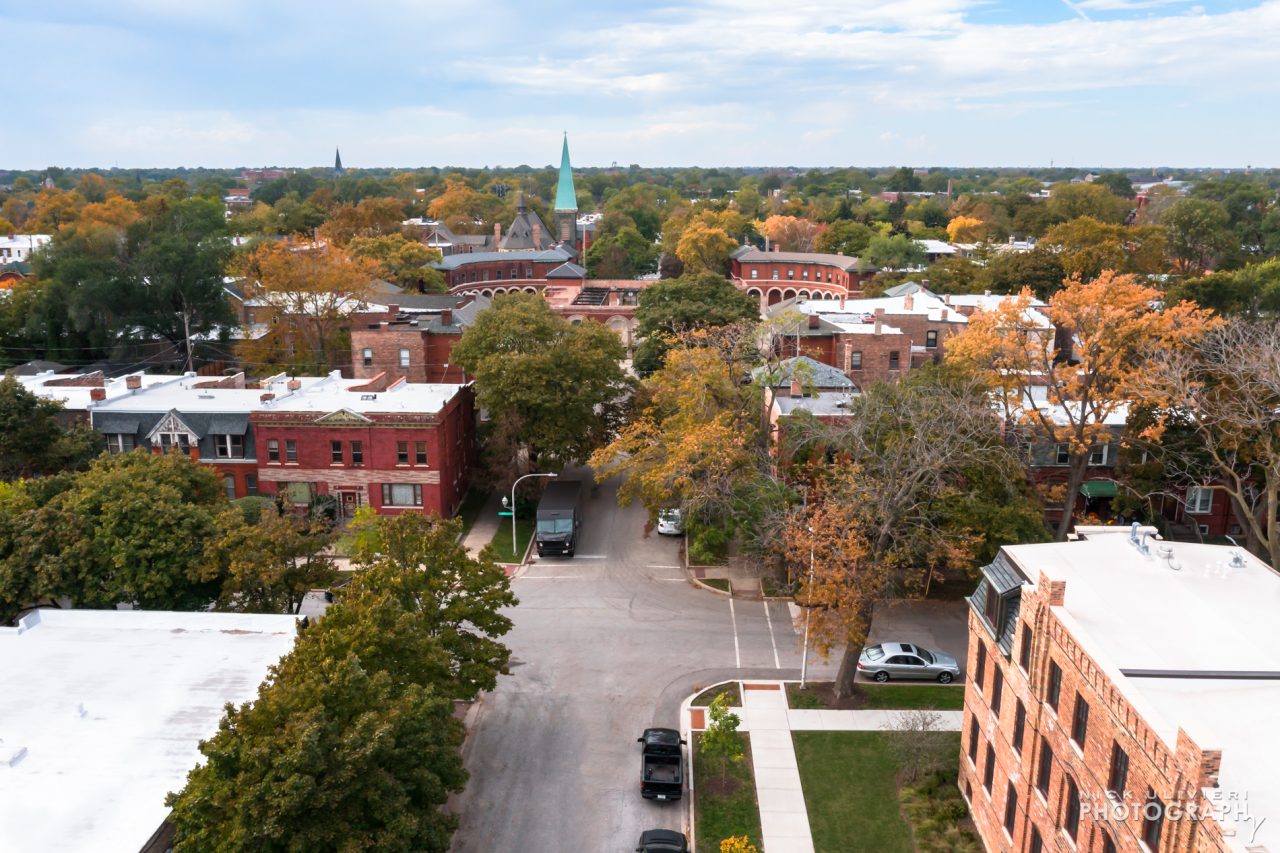 In the top-center of this photo, Pullman's ring-shaped central market can be seen with the rehabilitated building on the bottom right.