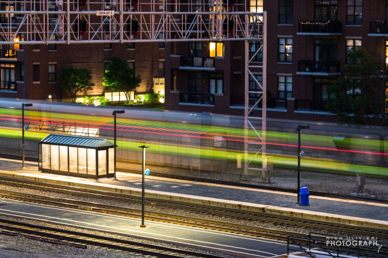 The Metra BNSF streaks by the Halsted stop.