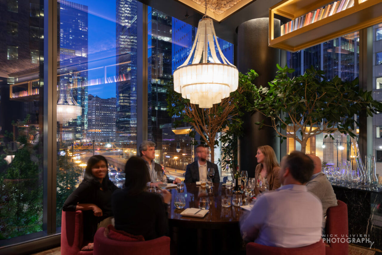 A large corner table provides a sweeping view of Wacker Drive