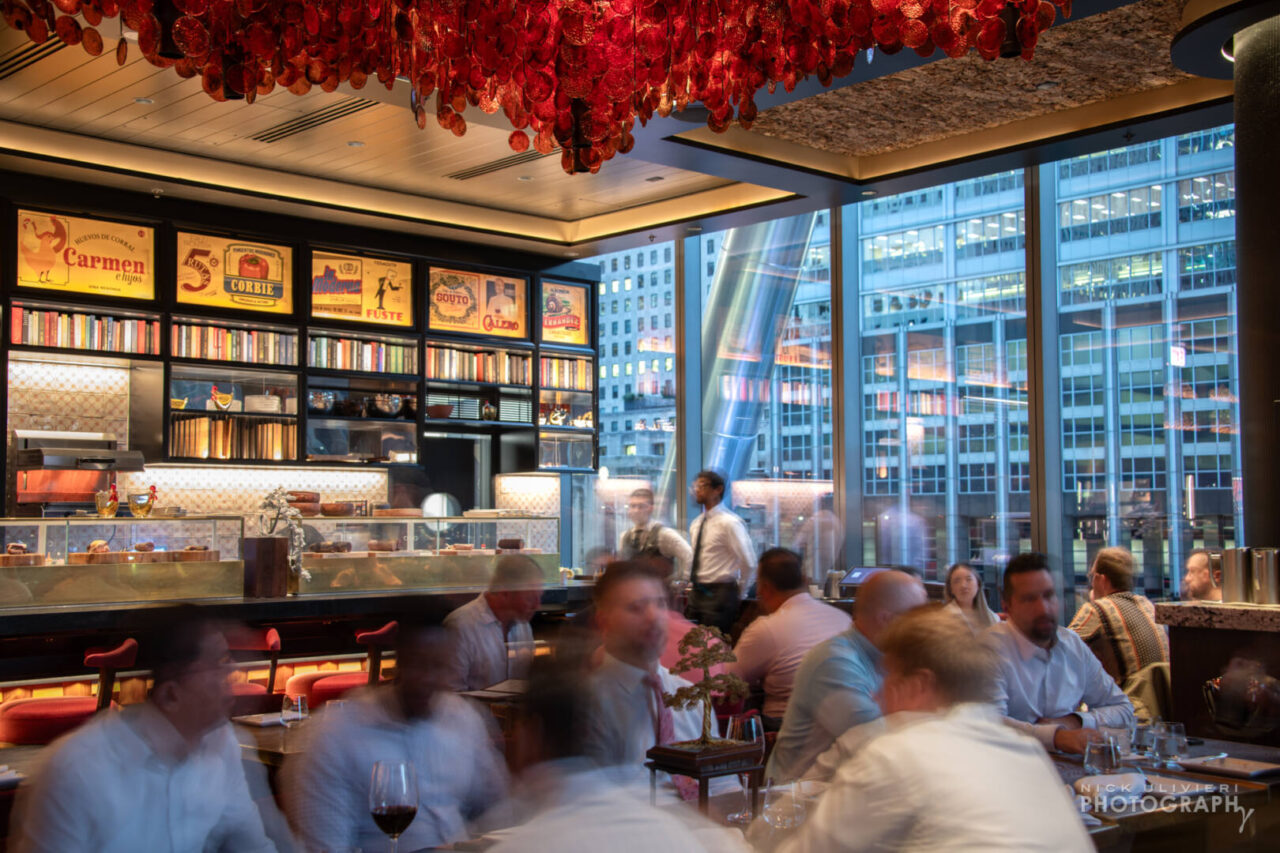The west side of the main dining room features massive windows with views that feature the structural trident column that define 110 N Wacker