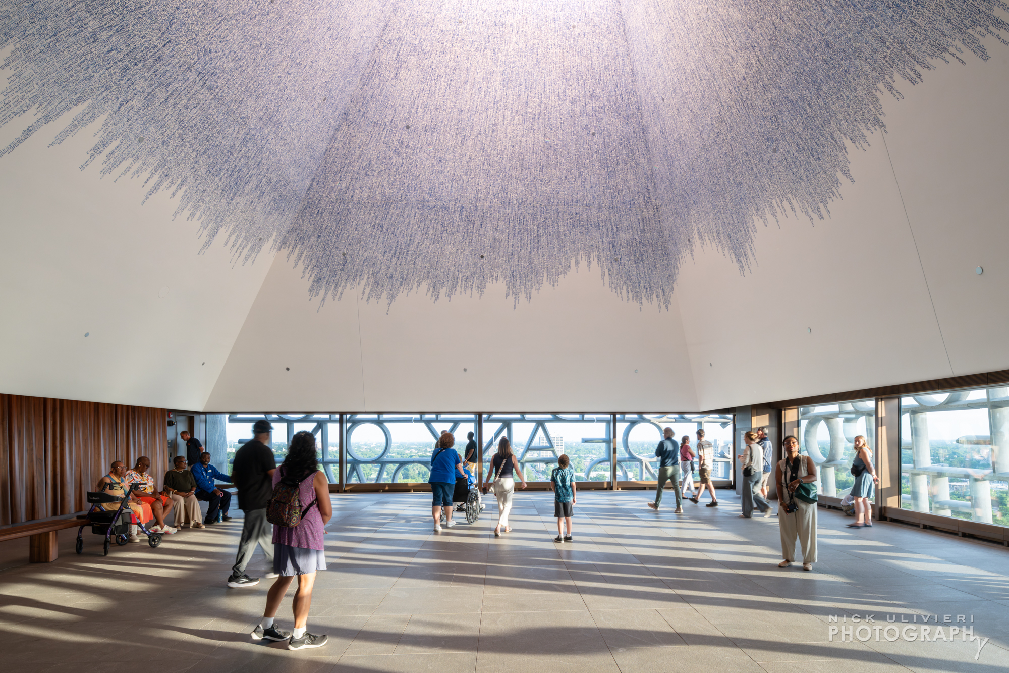 A wide-view of the Nelson Mandela Sky Room and its vaulted ceiling. The artwork, 'Sky of Hope' by Idris Kahn, is made up of words from Obama's 2015 Selma speech stamped onto the ceiling. (public)